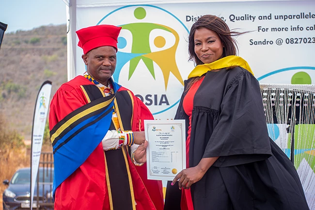 Graduate throwing cap in the air during ceremony