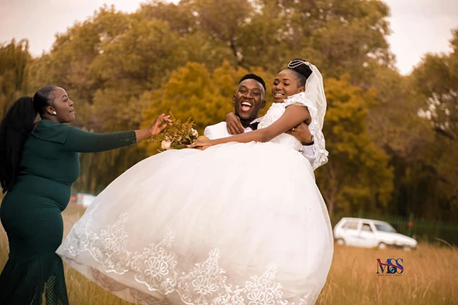 Bride and groom together outdoors wedding photoshoot